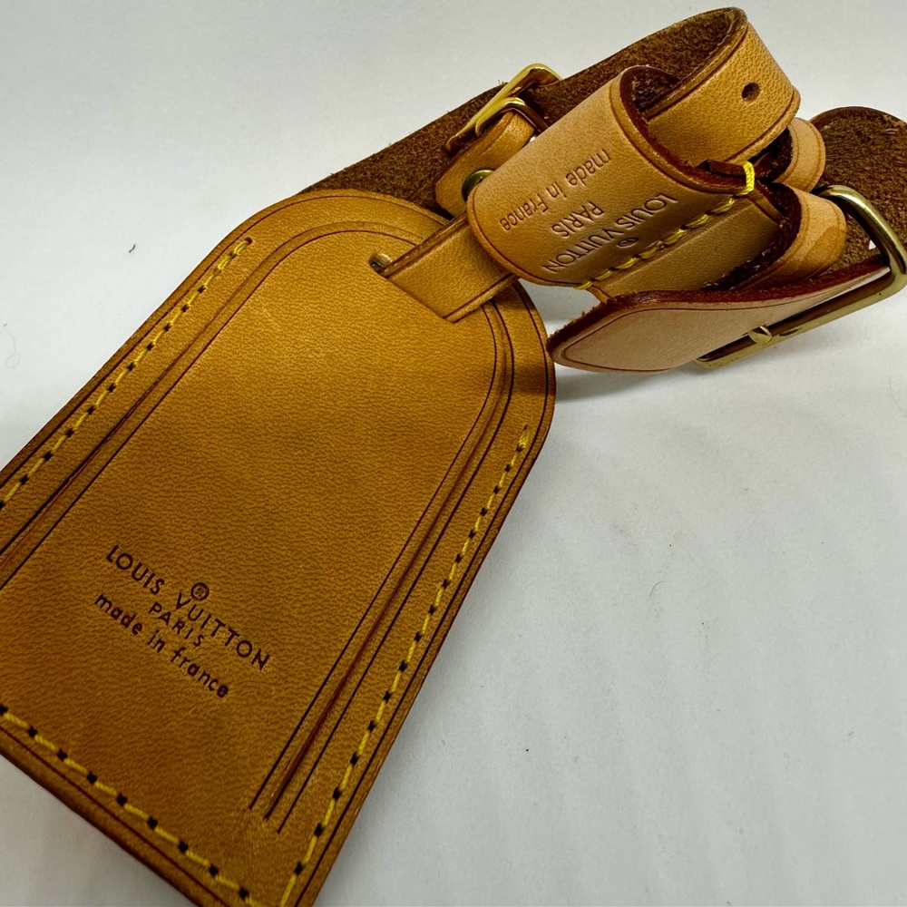 Louis Vuitton Vachetta leather luggage tag and strap set. Very nice condition!